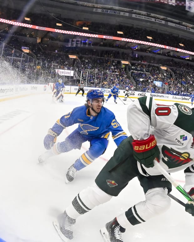 Mar 16, 2024; St. Louis, Missouri, USA; Minnesota Wild center Marcus Johansson (90) controls the puck as St. Louis Blues defenseman Matthew Kessel (51) defends during the first period at Enterprise Center.
